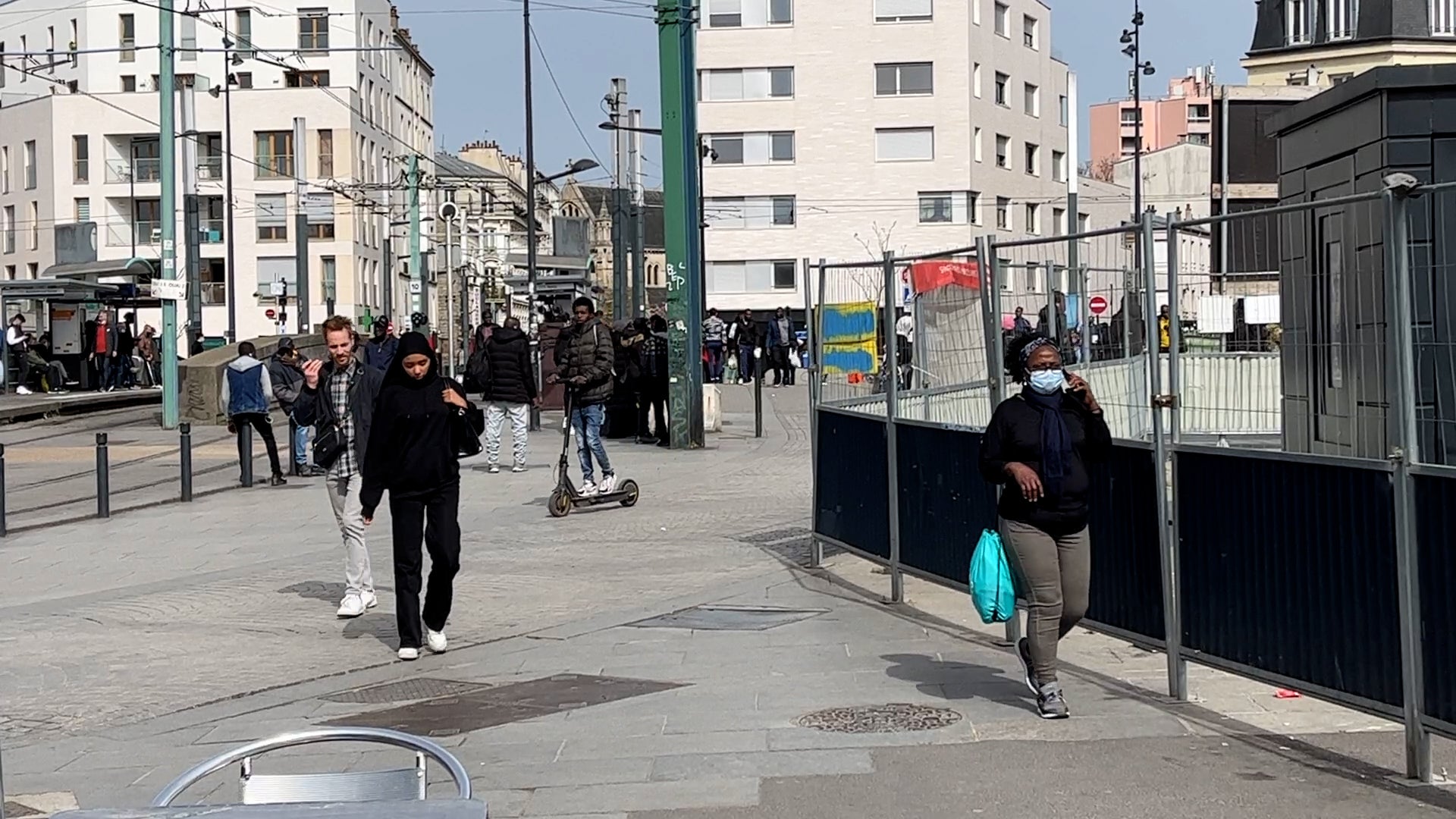 People walk through the streets in Seine-Saint-Denis
