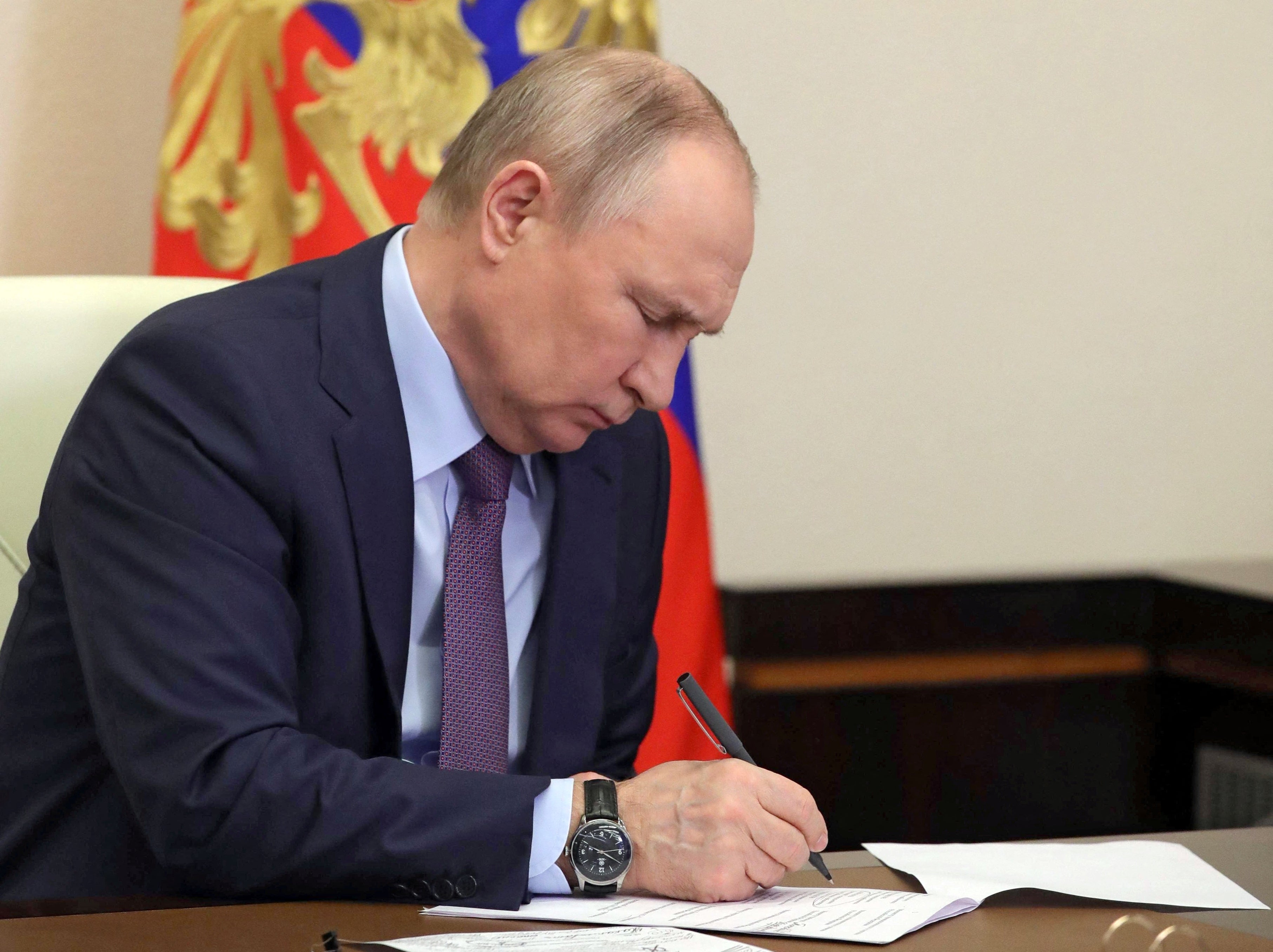 Putin chairs a meeting of the country’s oil and gas industry via a video link at a residence outside Moscow on Thursday