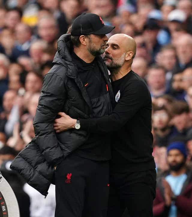 Pep Guardiola (right) and Jurgen Klopp are hoping for multiple honours this season (Martin Rickett/PA)