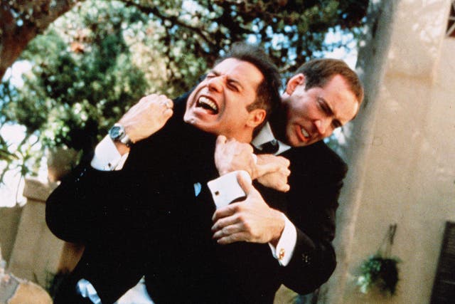 <p>John Travolta and Nicolas Cage in the positively deranged 1997 action film ‘Face/Off'</p>