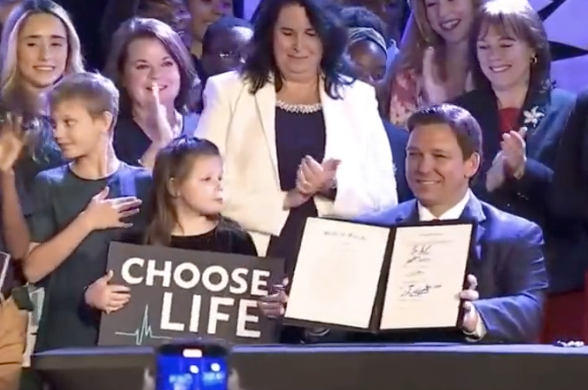 Republican Governor Ron DeSantis of Florida signing a near total abortion ban into law.