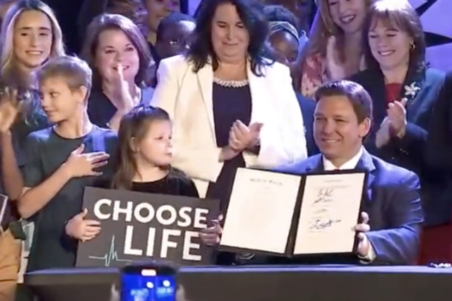<p>Republican Governor Ron DeSantis of Florida signing a near total abortion ban into law. </p>