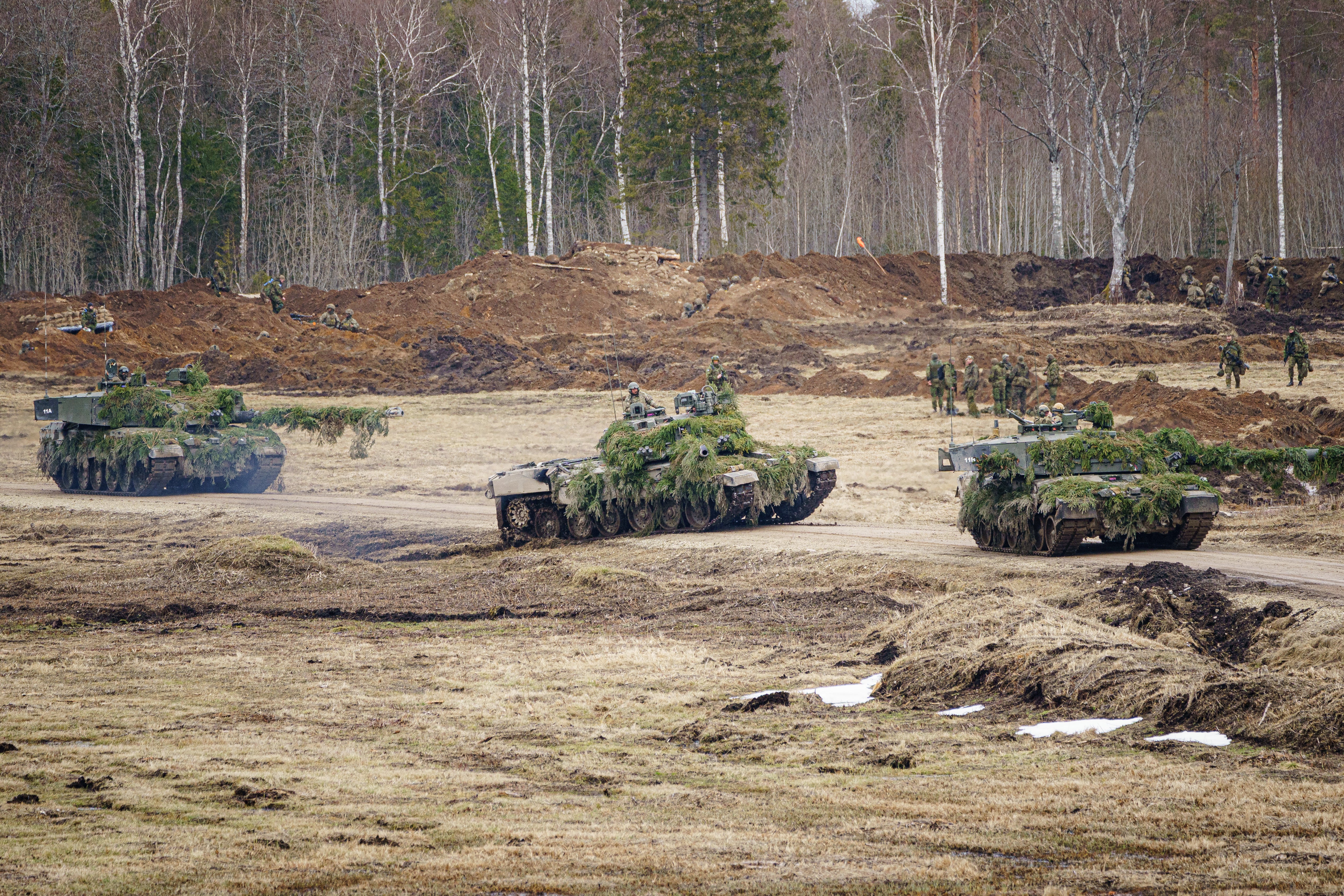 British Challenger II tanks on manoeuvres at the Tapa central military training area in Estonia on NATO exercise Bold Dragon alongside Estonian, Danish and French forces (Ben Birchall/PA)