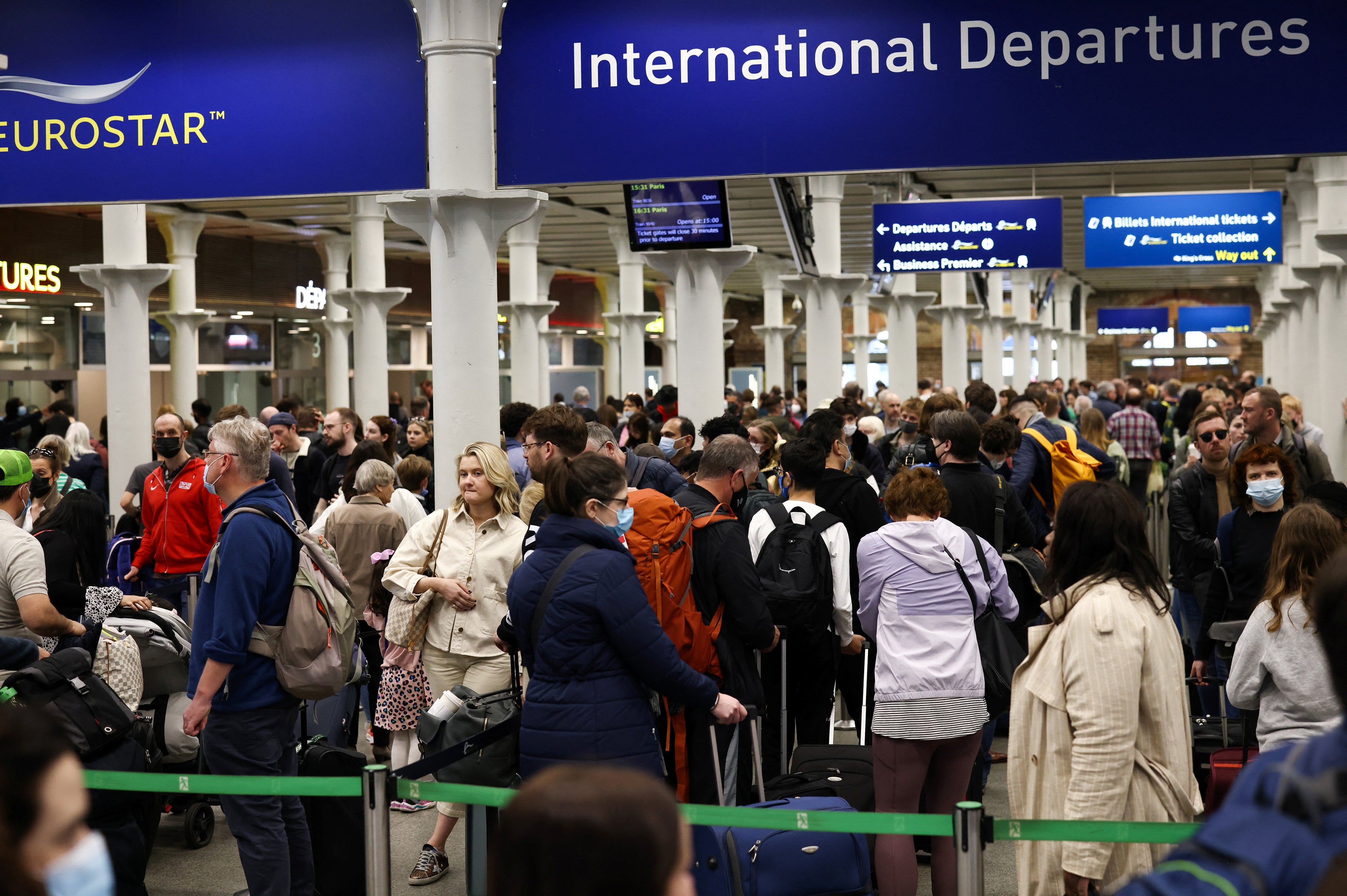 Passengers queue to check in for the Eurostar international rail service at London St Pancras, 14 April