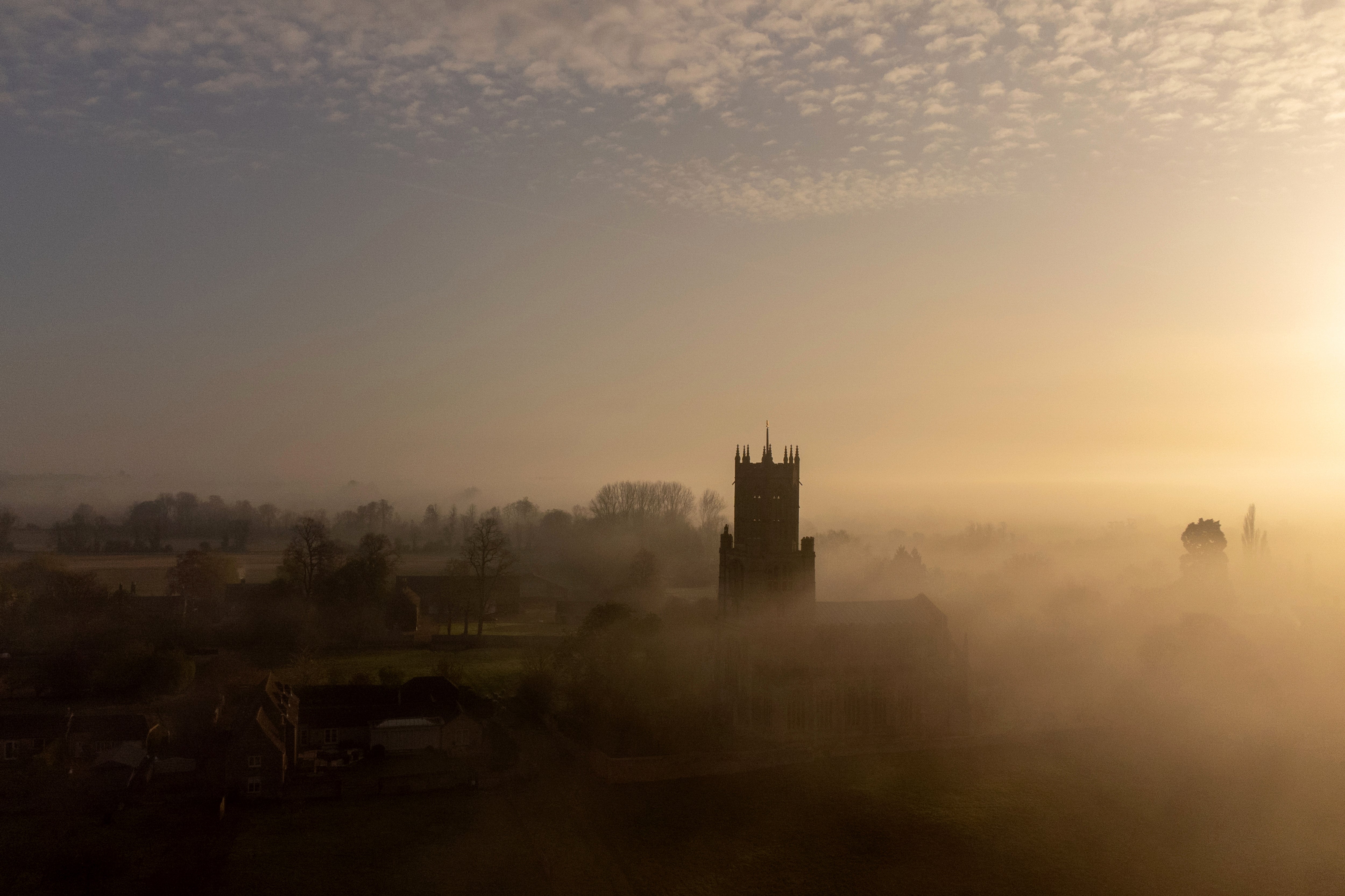 Mist hangs over St Mary and All Saints Church in Fotheringhay, Northamptonshire (Joe Giddens/PA)
