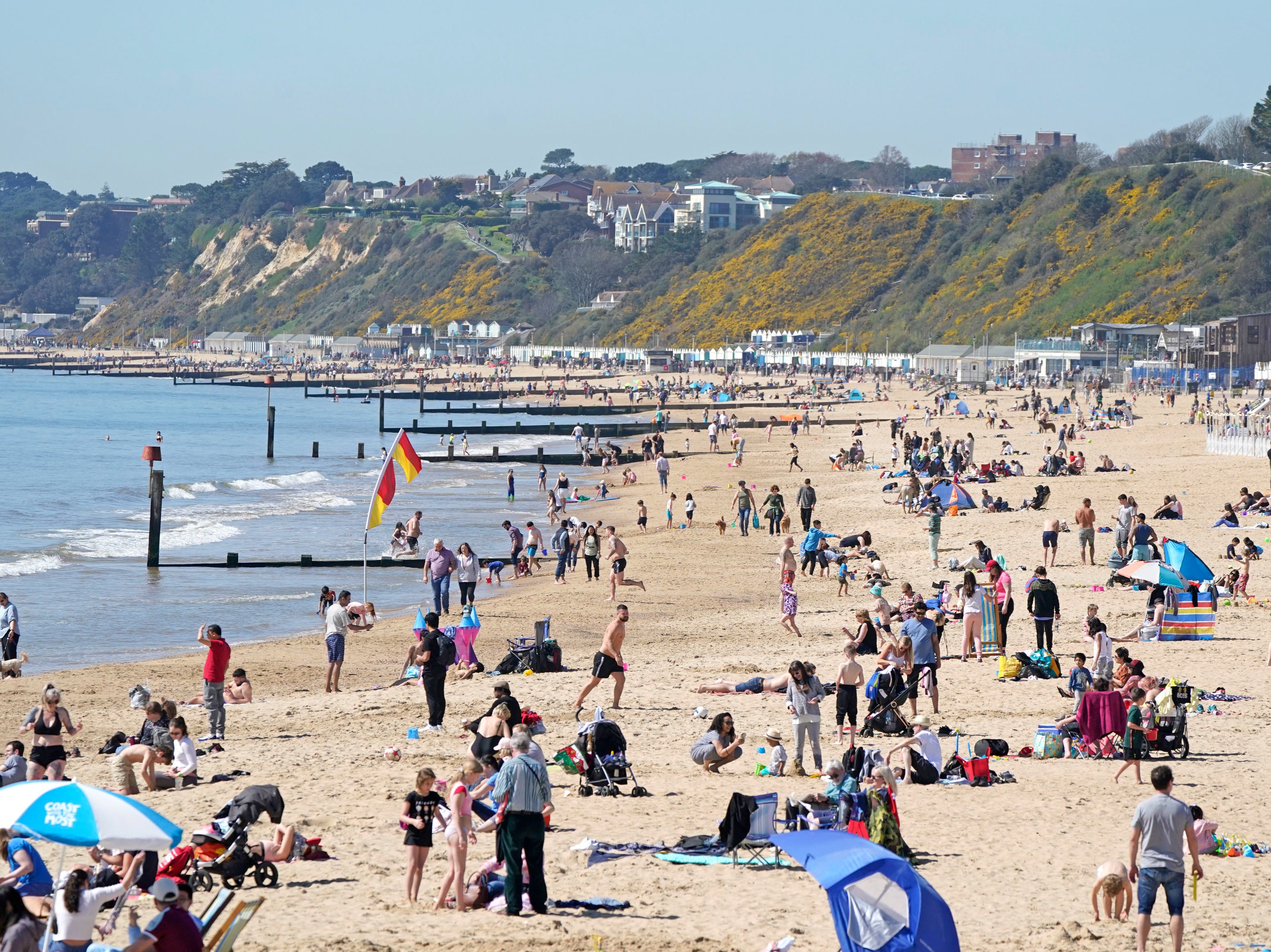 People on the beach in Bournemouth as Good Friday is expected to be the hottest day of the year so far
