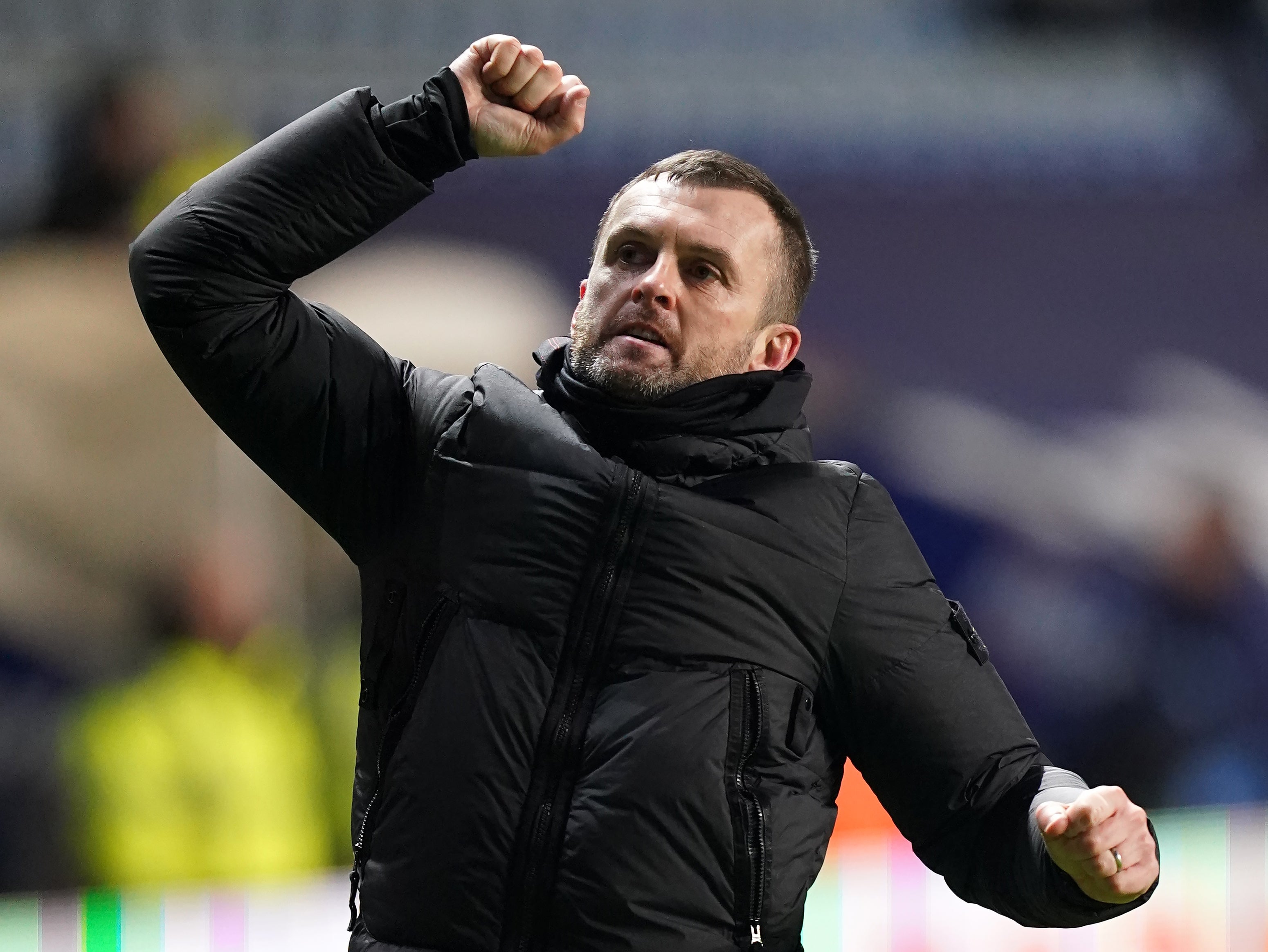Luton Town manager Nathan Jones salutes the fans after the final whistle following the Sky Bet Championship match at the Coventry Building Society Arena, Coventry. Picture date: Tuesday March 8, 2022.