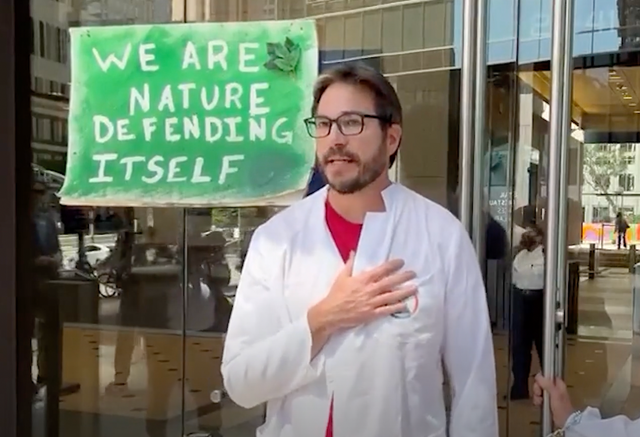 <p>Climate scientist Peter Kalmus during a protest with Scientist Rebellion in Los Angeles last week </p>