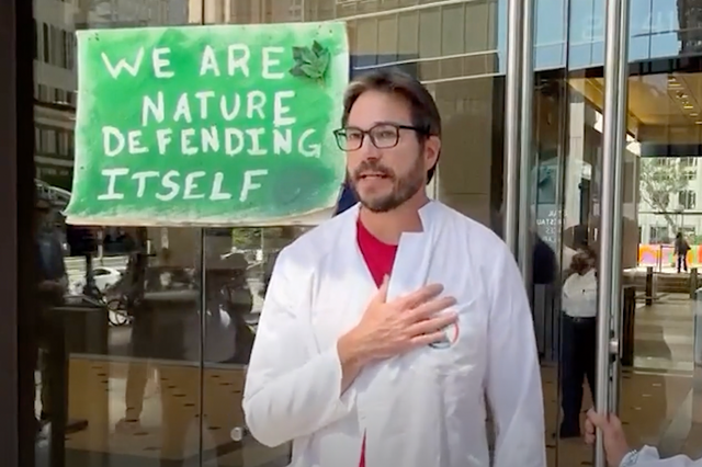<p>Climate scientist Peter Kalmus during a protest with Scientist Rebellion in Los Angeles last week </p>