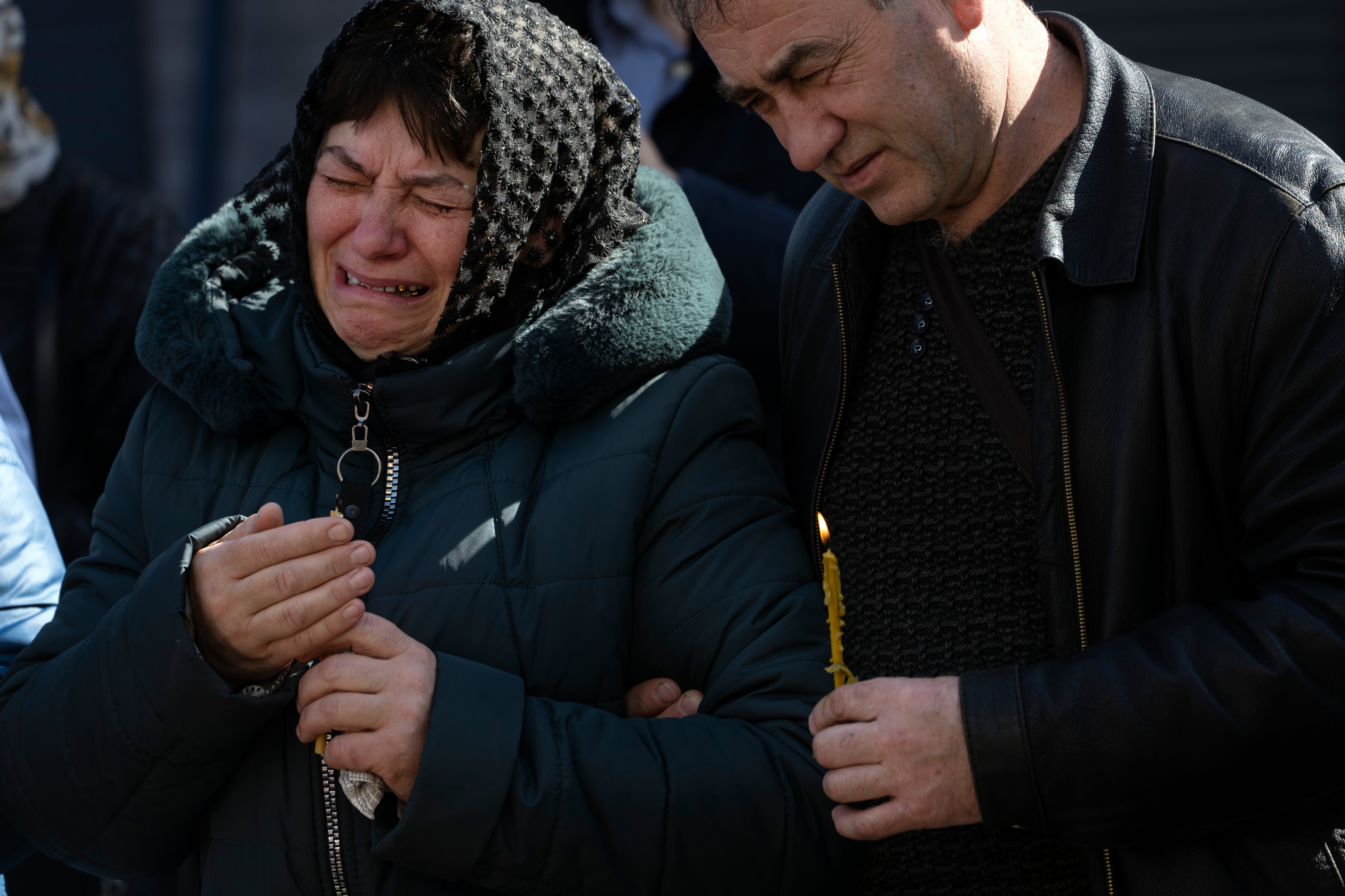 Relatives mourn fallen soldiers in Irpin, on the outskirts of Kyiv