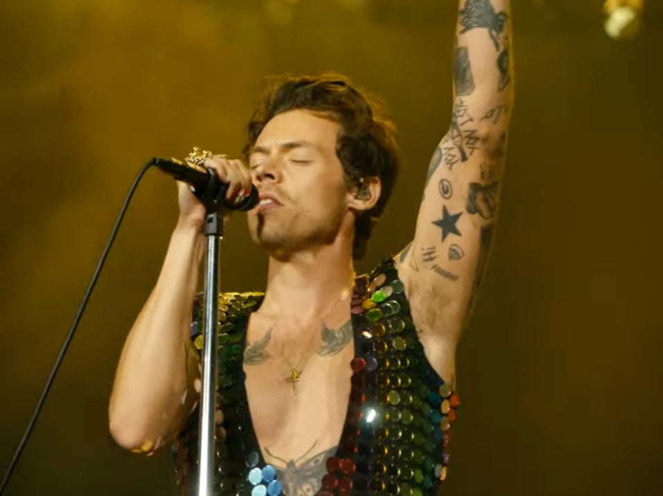 <p>Harry Styles performing at Coachella </p>