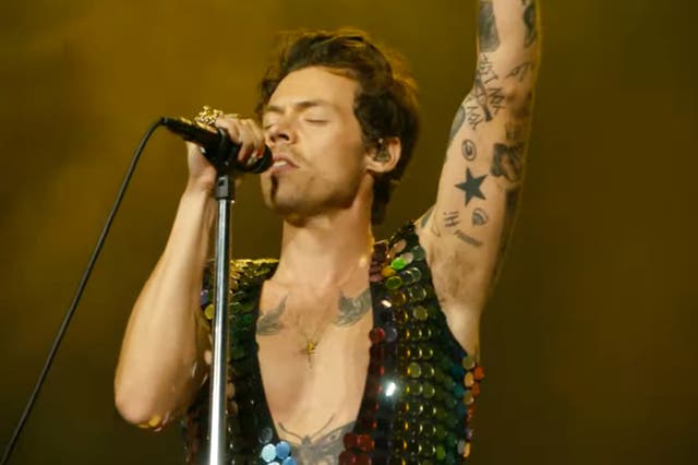 <p>Harry Styles performing at Coachella </p>
