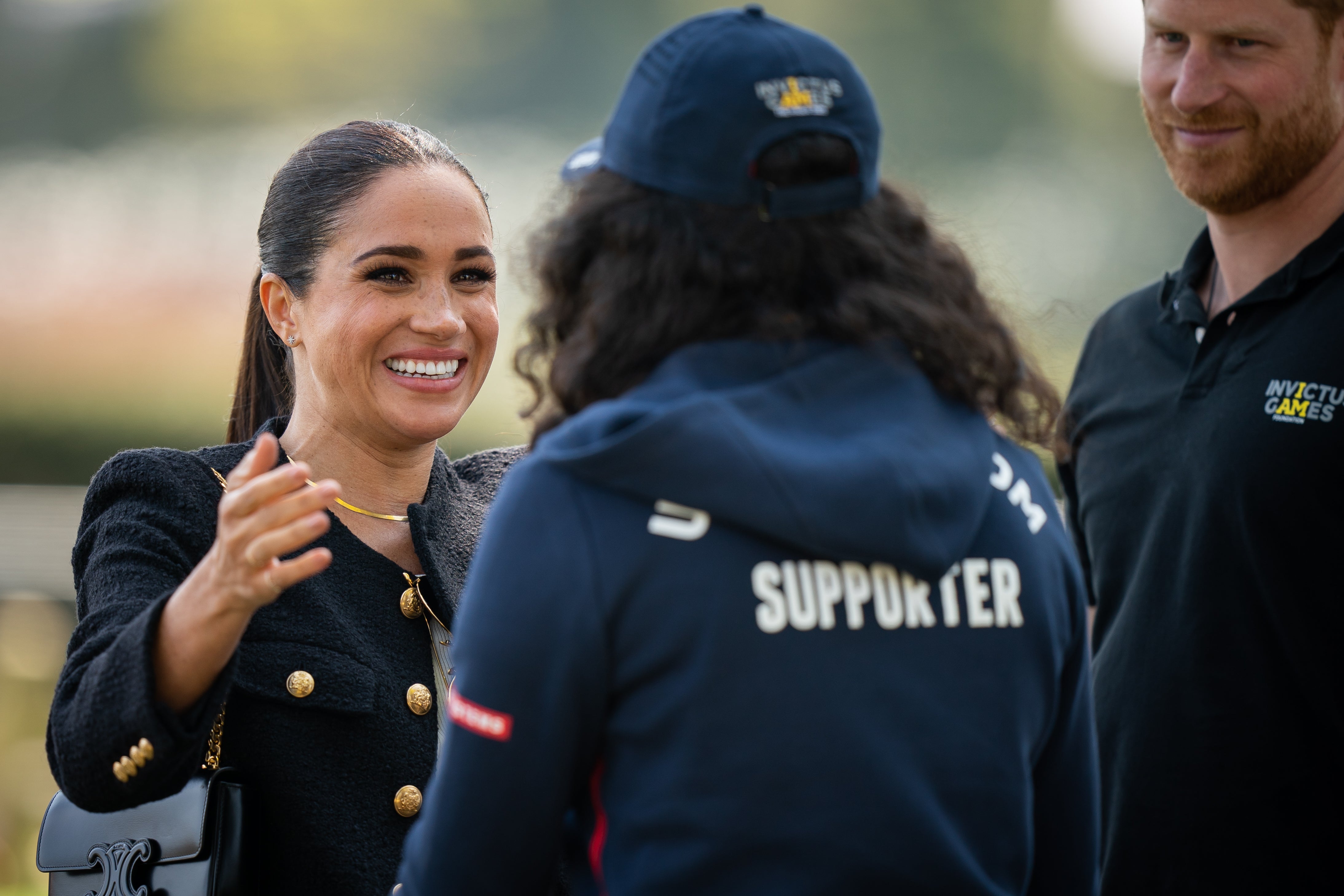 Meghan hugs a UK supporter during the Invictus Games at Zuiderpark (Aaron Chown/PA)