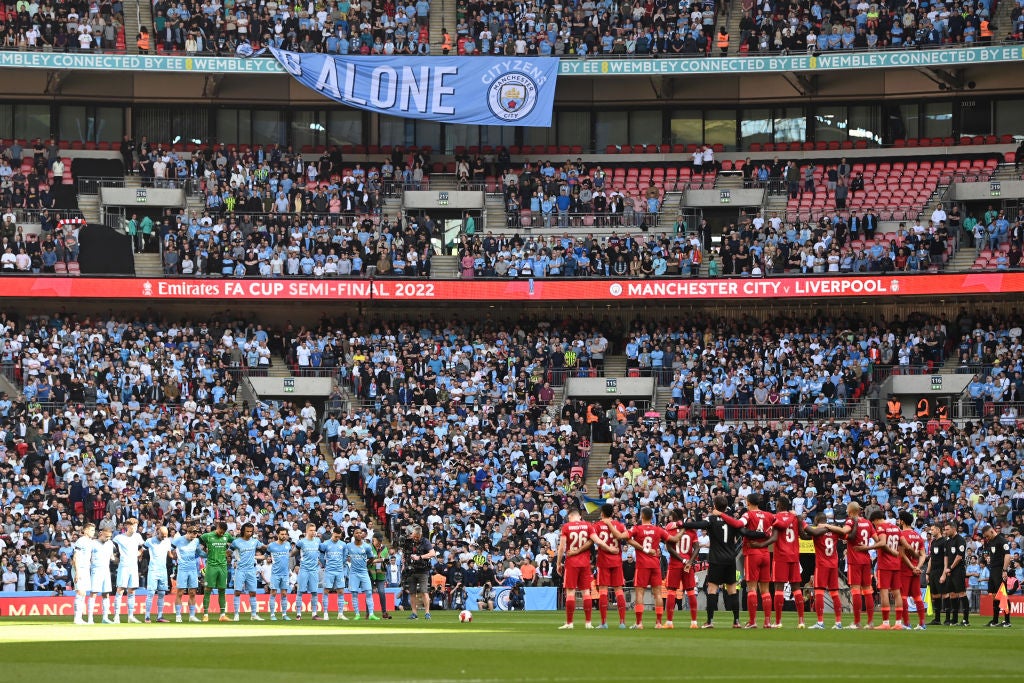 Both teams lined up on the centre circle but the minute’s silence was brought to an end after around 20 seconds