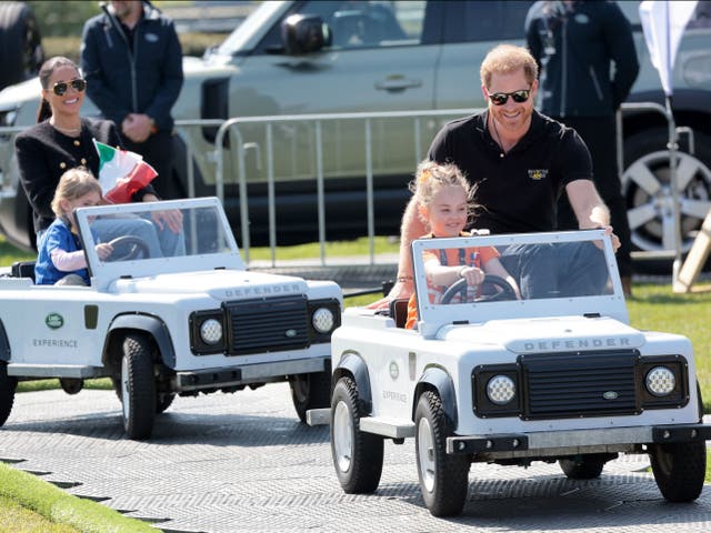 <p>Prince Harry and Meghan Markle are seen riding with kids in Land Rover Mini Defenders at the Jaguar Land Rover Driving Challenge on day one of the Invictus Games The Hague 2020 at Zuiderpark</p>