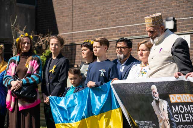 102-year-old Dabirul Islam Choudhury (right) is joined by Ukrainian refugees and members of his local community (Dominic Lipinski/PA)