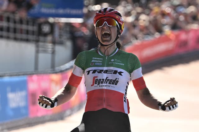 <p>Trek-Segafredo's Italian rider Elisa Longo Borghini celebrates as she crosses the finish line to win the second edition of the Paris-Roubaix one-day classic cycling race, between Denain and Roubaix, in the Roubaix Velodrome in northern France</p>