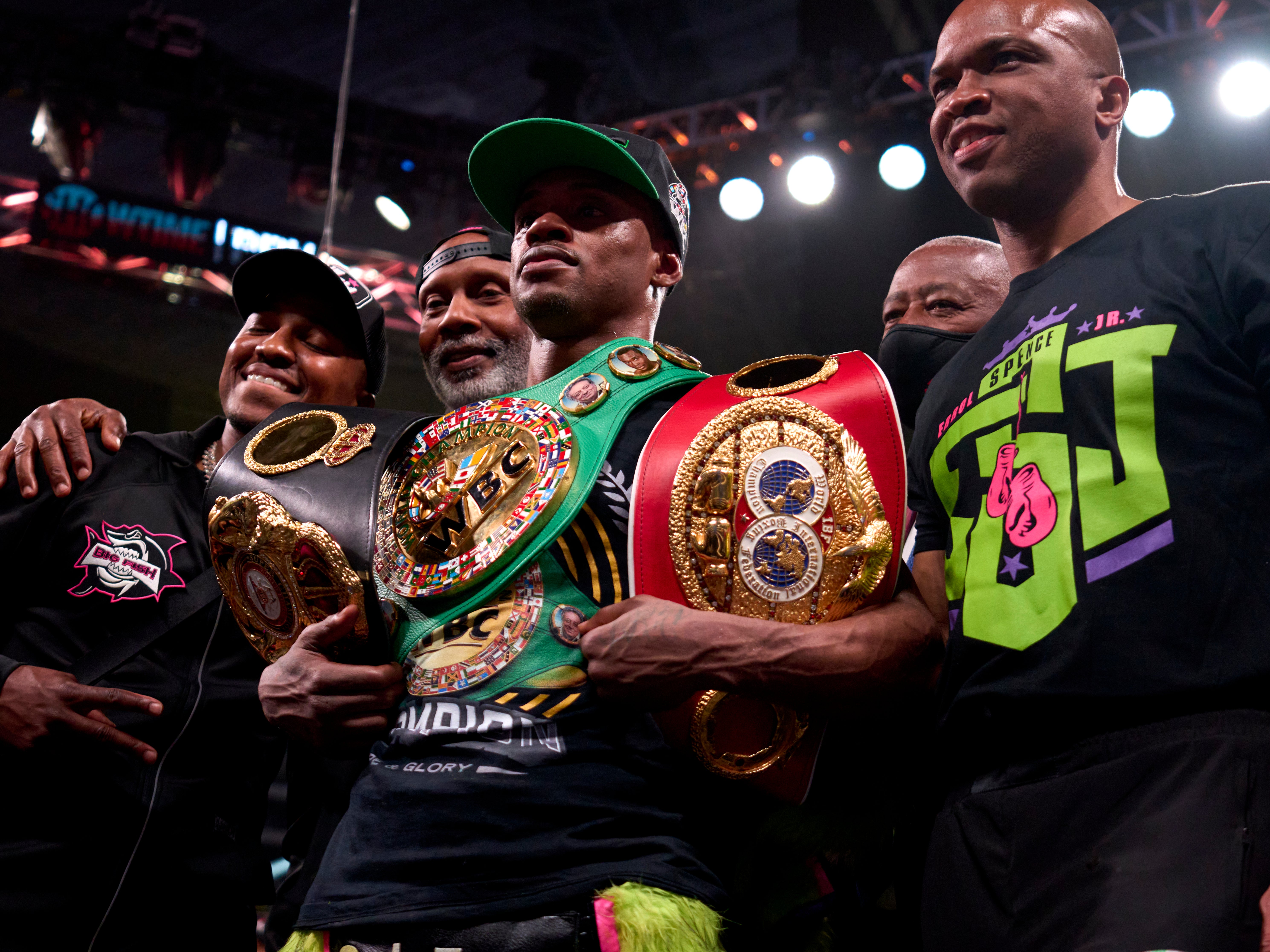 Errol Spence Jr (centre) celebrates after collecting another welterweight belt