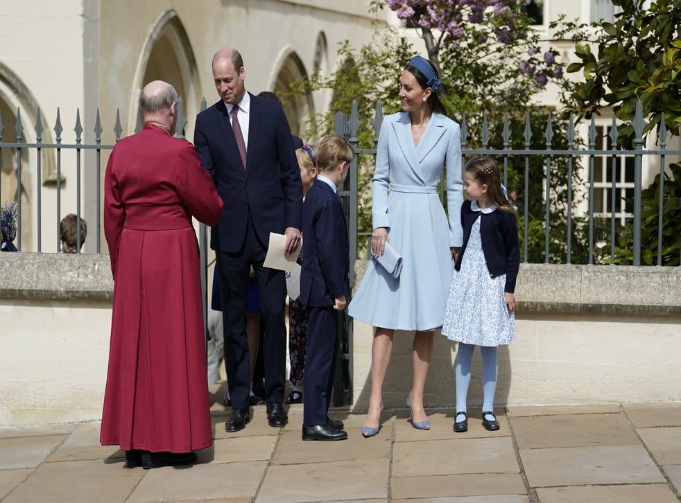 The Duke and Duchess of Cambridge, Princess Charlotte and Prince George, shake hands with Dean of Windsor, the Right Rev David Conner (Andrew Matthews/PA)