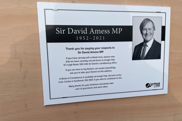A sign placed next to the floral tributes left outside the Belfairs Methodist Church in Leigh-on-Sea, Essex, where Conservative MP Sir David Amess was killed (Sam Russell/PA)
