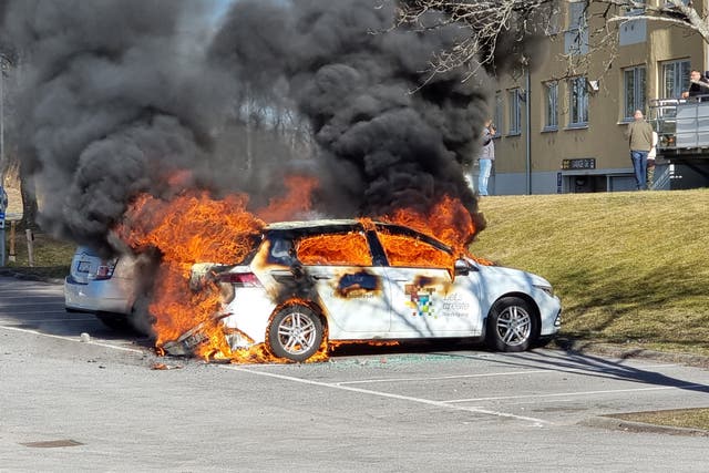 <p>Smoke billows from a burning car during a riot ahead of a demonstration planned by Danish anti-Muslim politician Rasmus Paludan </p>