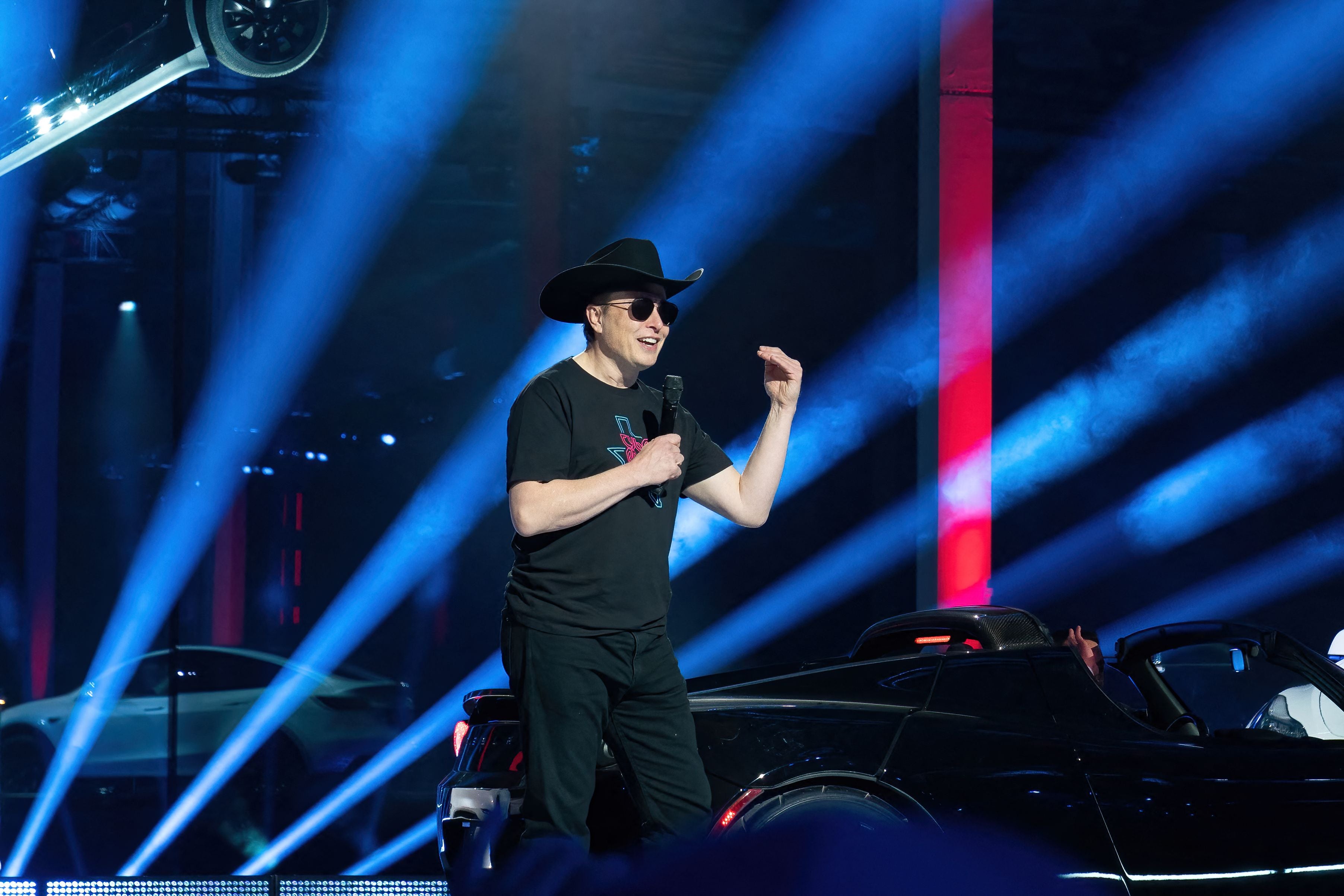 <p>CEO of Tesla Motors Elon Musk speaks at the Tesla Giga Texas manufacturing “Cyber Rodeo” grand opening party on 7 April in Austin, Texas</p>
