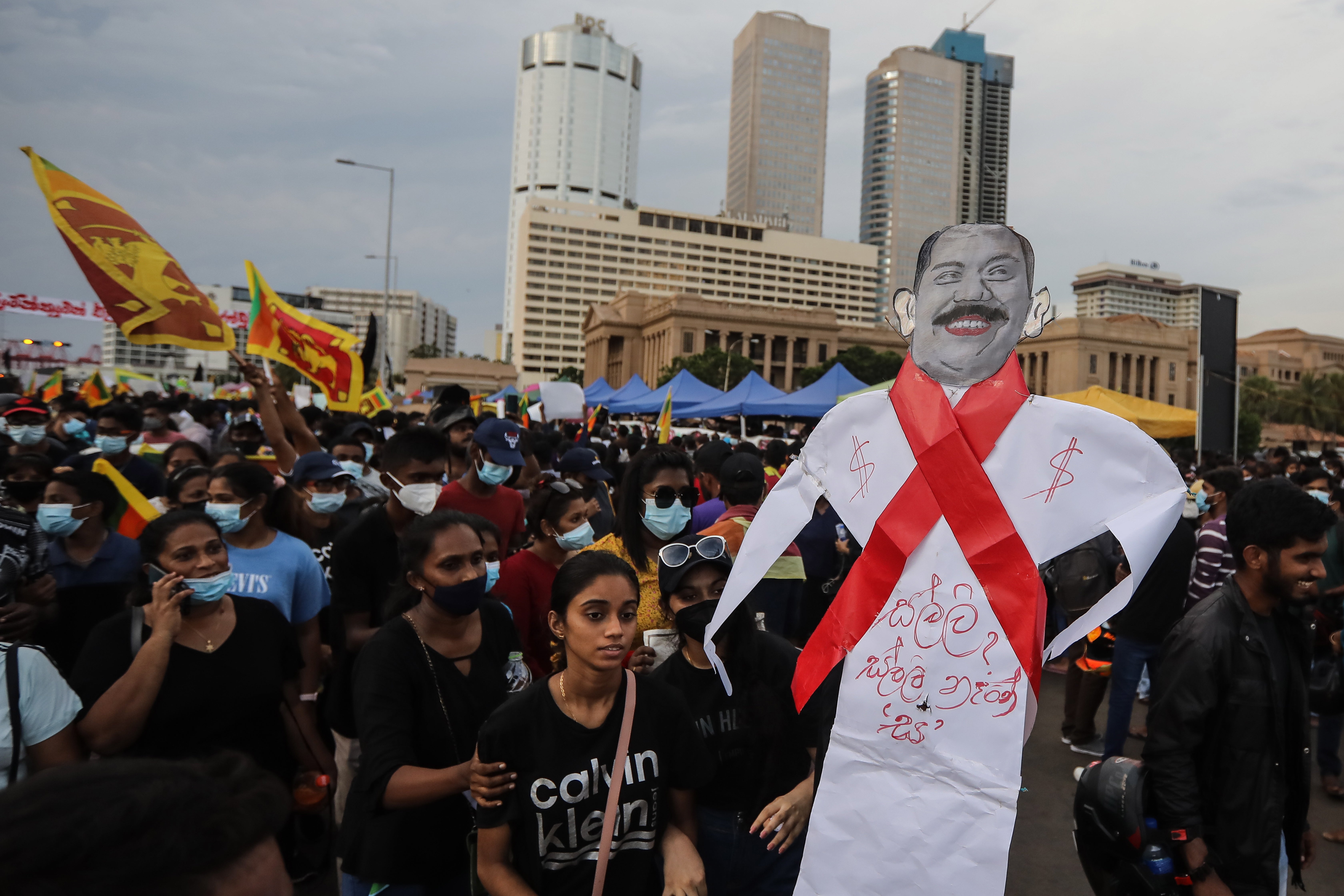 <p>Protesters shout slogans during the day and night demonstrations in front of the presidential secretariat in Colombo</p>