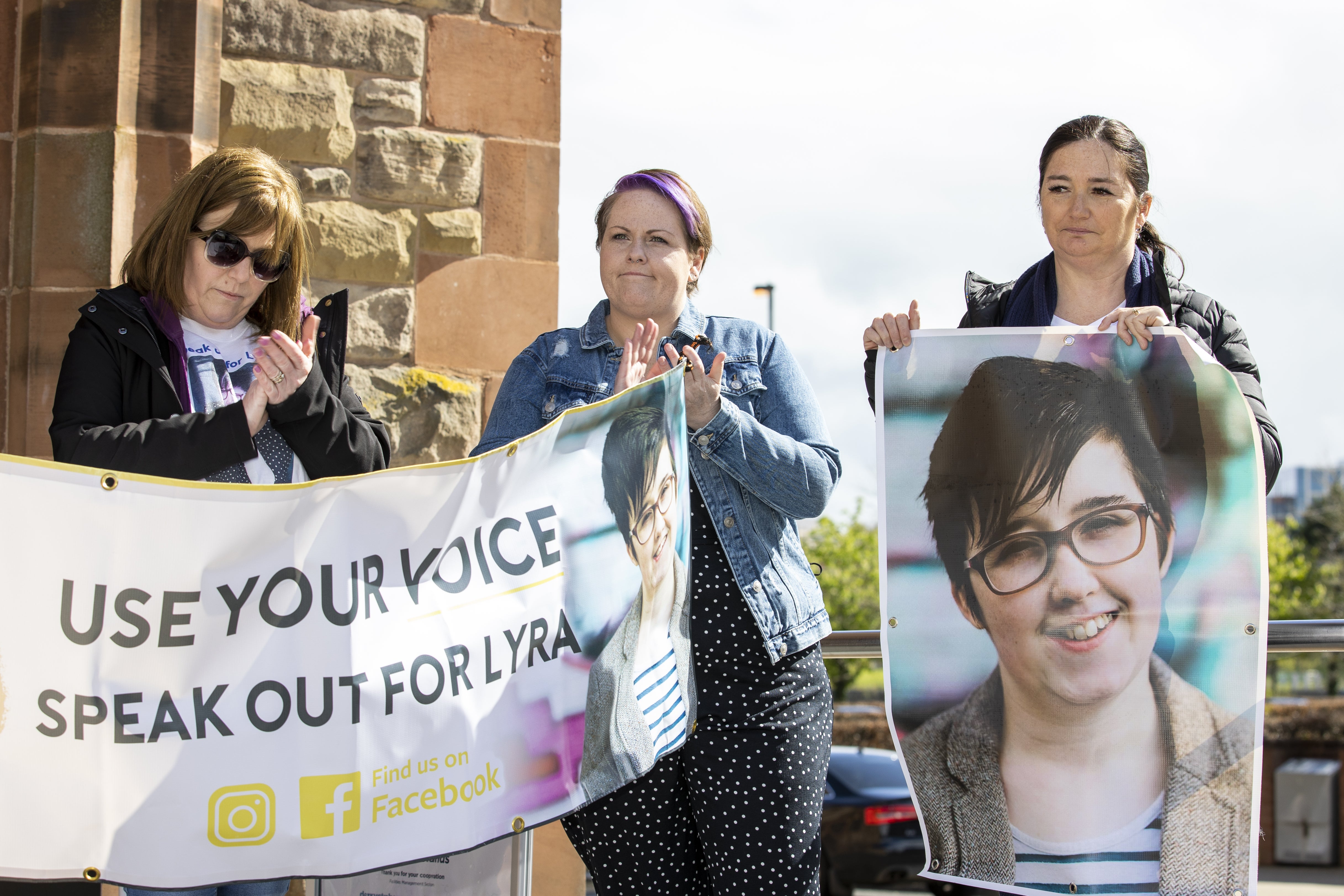 Lyra McKee’s sisters’ Nichola Corner (left) and Joan Hunter (right) stand with Ms McKee’s partner Sara Canning (centre) during a vigil attended by members of the National Union of Journalists (NUJ) at the Guildhall in Derry, to mark the third anniversary of Lyra McKee’s murder.