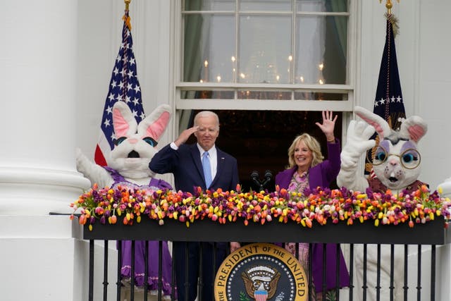 <p>President Joe Biden appears and salutes with first lady Jill Biden and the Easter Bunnies on the Blue Room balcony at the White House during the White House Easter Egg Roll, Monday, April 18, 2022, in Washington. (AP Photo/Andrew Harnik)</p>