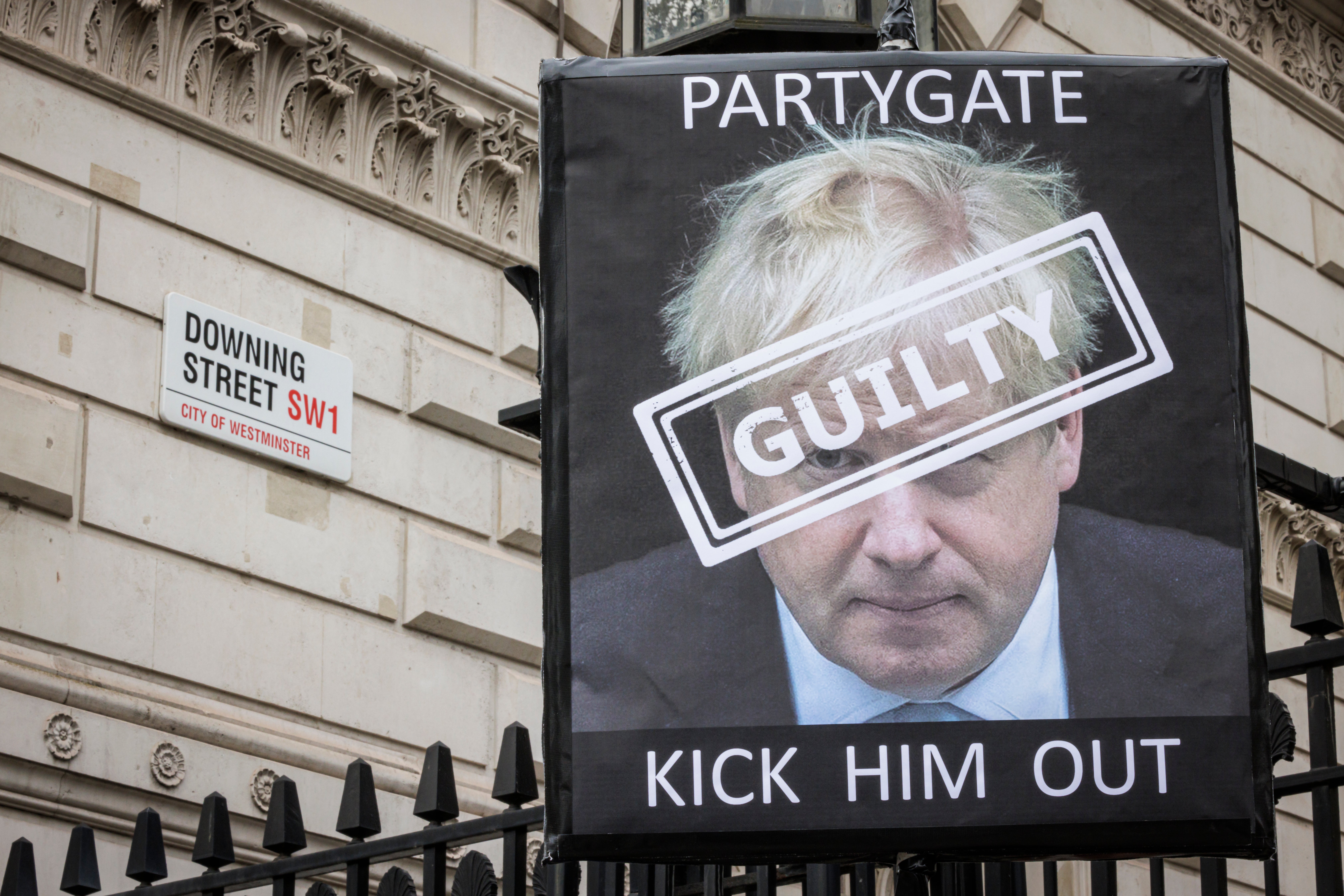 A protest sign is seen outside Downing Street