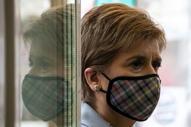 <p>Sturgeon was filmed without a face covering inside a barber shop on Saturday </p>