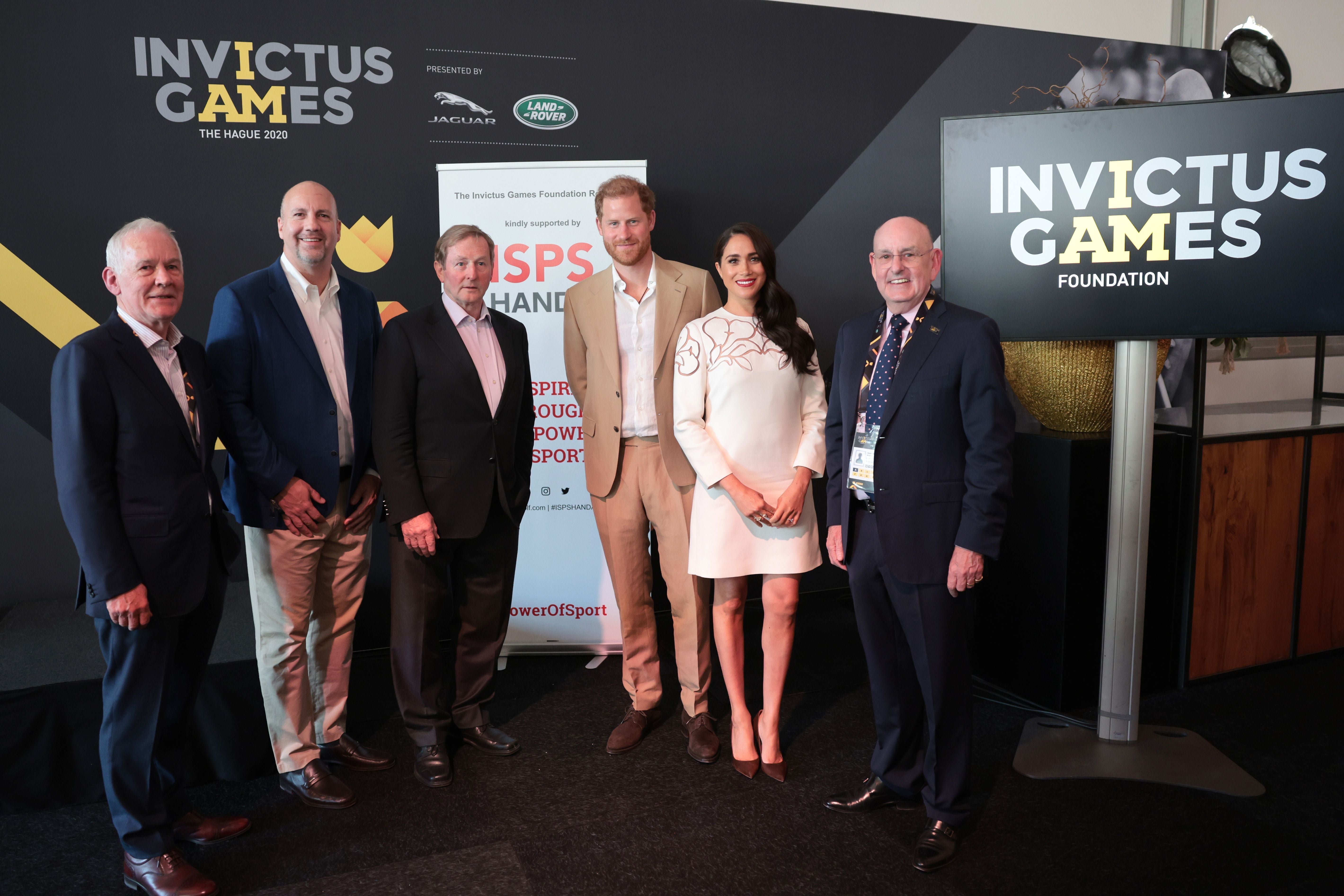 Meghan Markle wears red lipstick and Valentino dress during Invictus Games