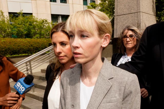 <p>FILE - Sherri Papini of Redding leaves the federal courthouse accompanied by her attorney, William Portanova, right, in Sacramento, Calif., April 13, 2022</p>