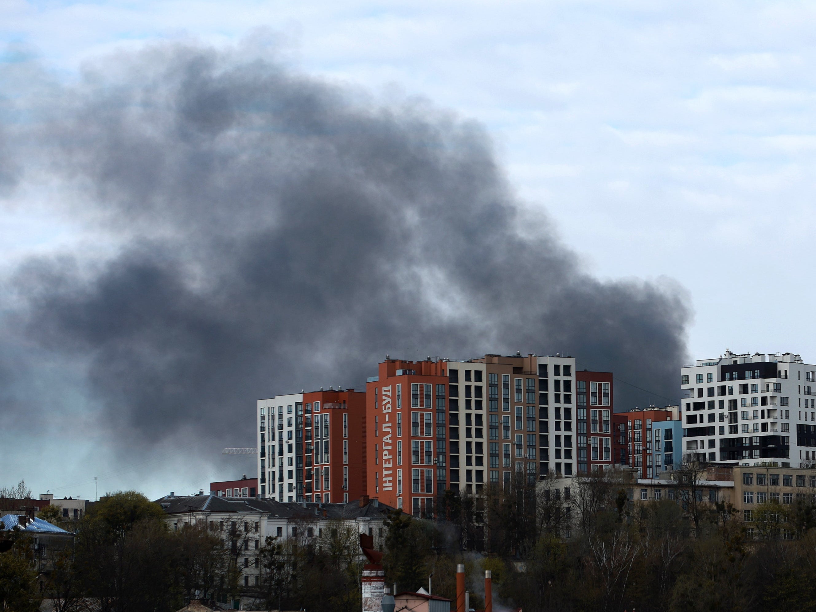 Smoke is seen on the horizon after Russian missiles struck Lviv