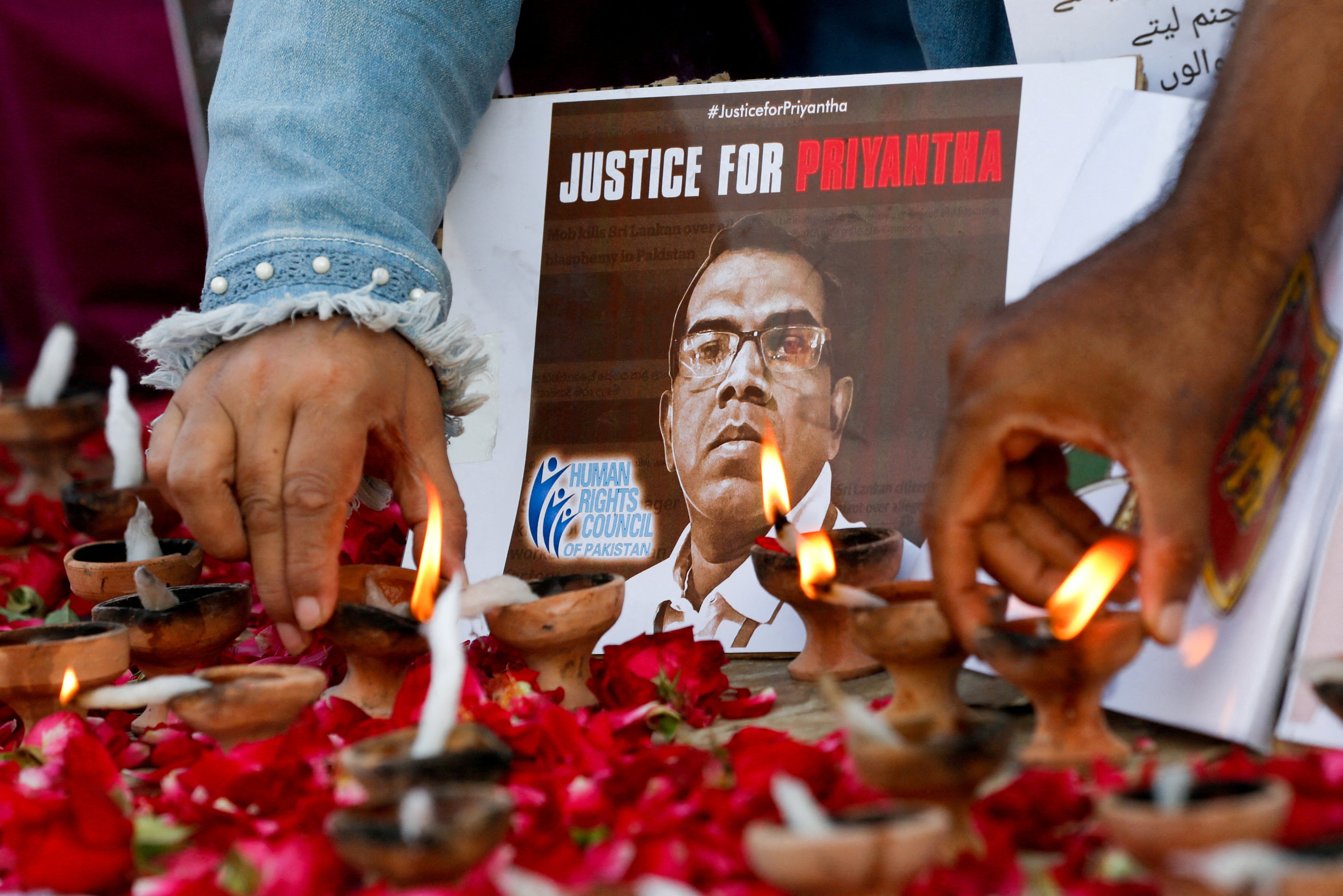 File photo: People express their condolences in Karachi on 5 December 2021