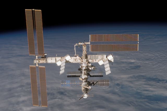 <p>In this handout from Nasa, the International Space Station is seen from the Space Shuttle Discovery </p>