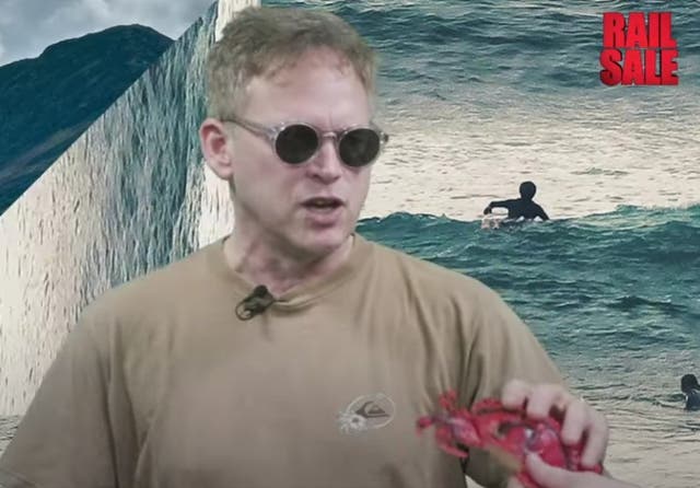 <p>Low point? Mr Shapps is handed a plastic crab and cheap sunglasses in the rail promotion video</p>