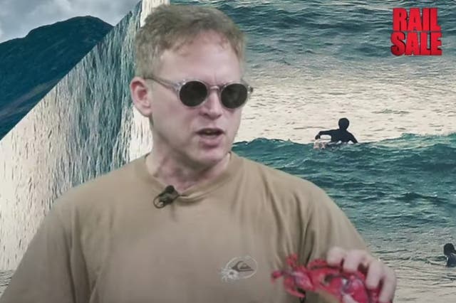 <p>Low point? Mr Shapps is handed a plastic crab and cheap sunglasses in the rail promotion video</p>
