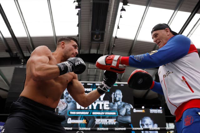 <p>Tommy Fury trains with father John</p>