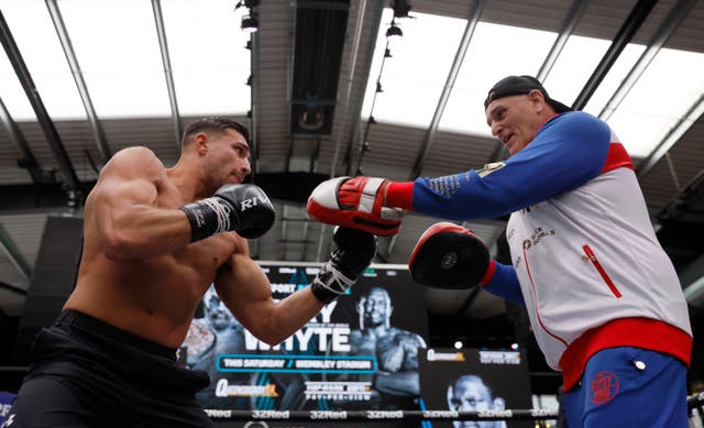 <p>Tommy Fury trains with father John</p>