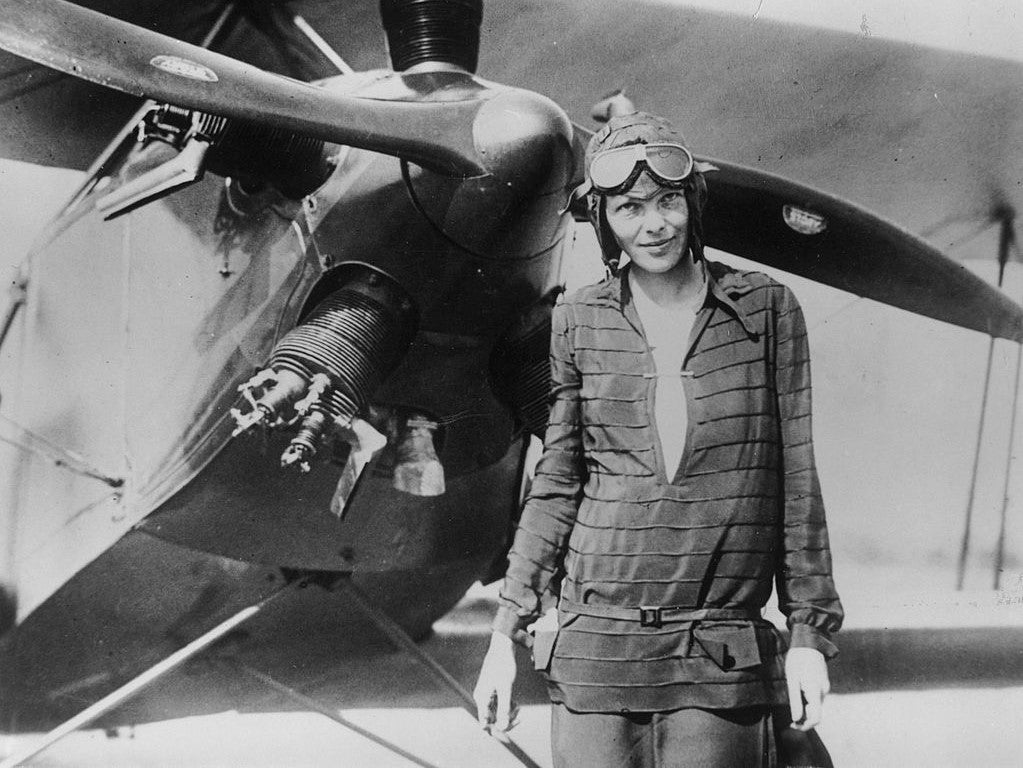 Amelia Earhart stands June 14, 1928 in front of her bi-plane called "Friendship" in Newfoundland.