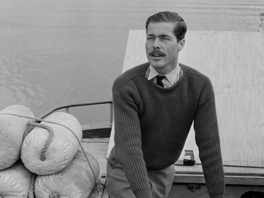 Lord Lucan pictured working on the engine of his powerboat 'White Migrant'