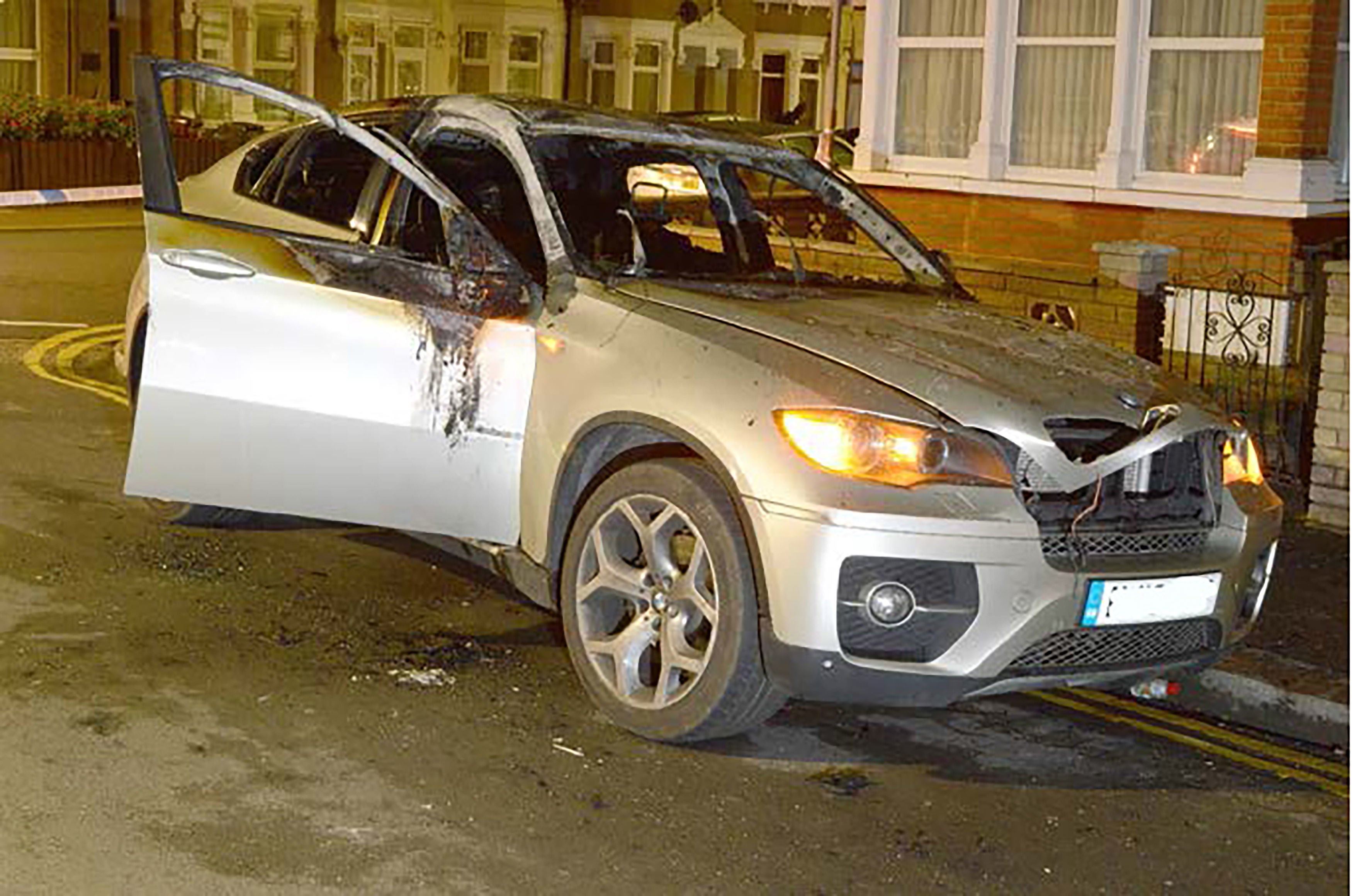 The burnt out BMW which was used by father and son to murder John Avers, 47