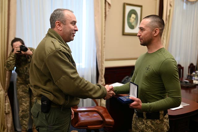 <p>Ukrainian Roman Gribov, who was captured by Russian troops on Snake Island on February 24 and recently swapped for Russian POWs, receives an award</p>