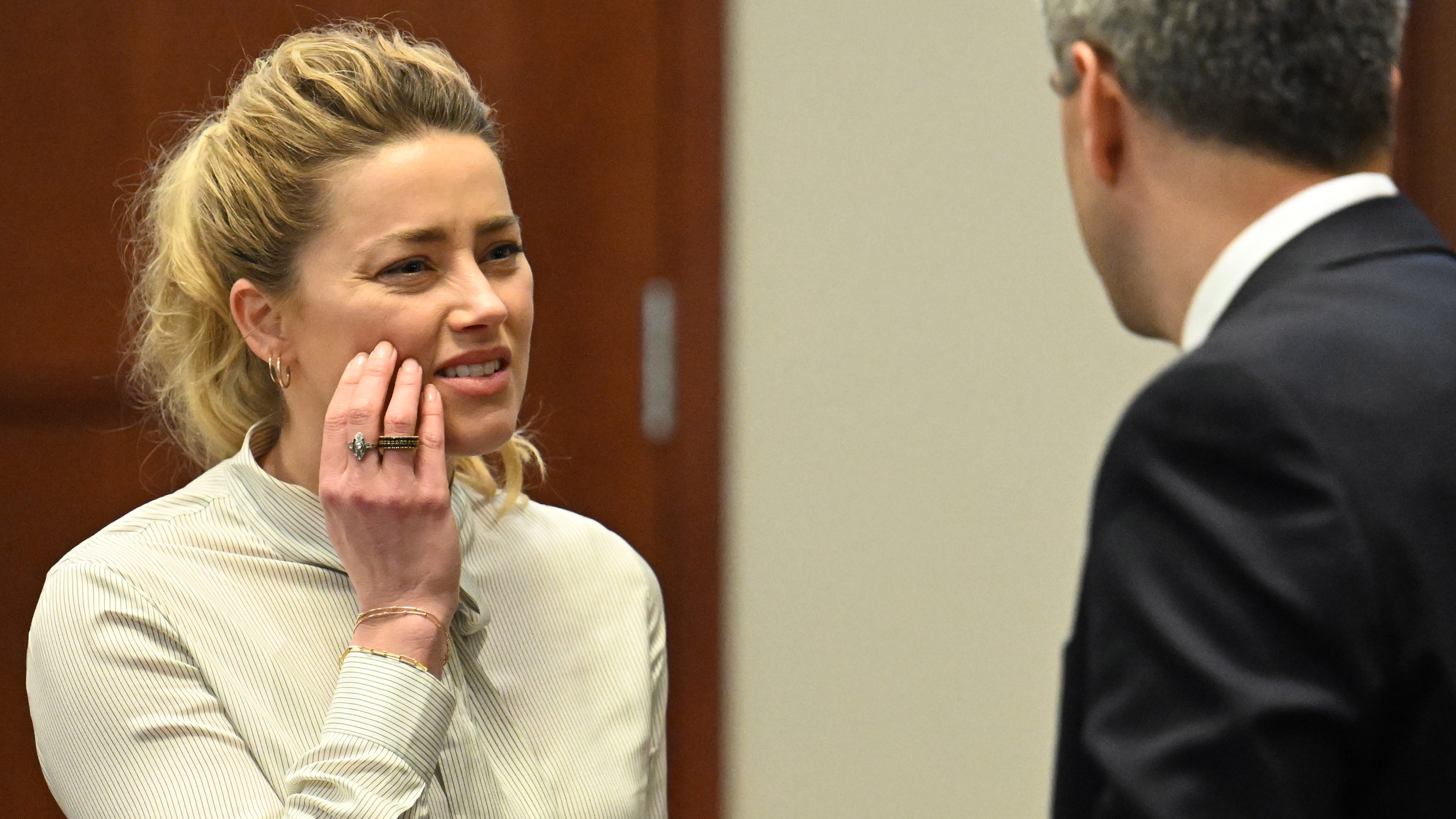 US actress Amber Heard looks on during a trial in the Fairfax County Circuit Courthouse in Fairfax, Virginia, USA, 19 April 2022