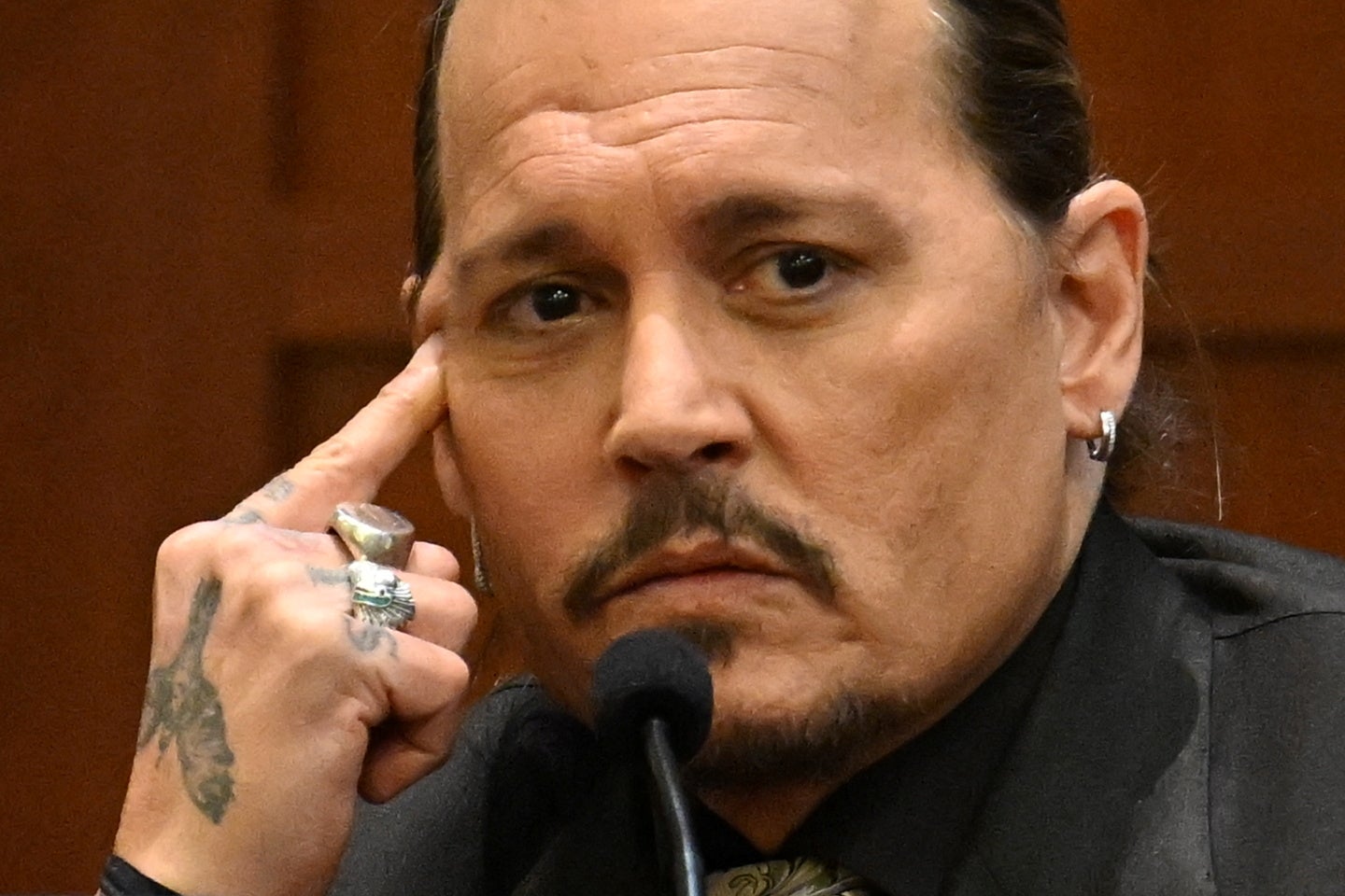 Actor Johnny Depp testifies at the Fairfax County Circuit Courthouse as his defamation case against ex-wife Amber Heard continues, in Fairfax, Virginia, U.S., April 19, 2022