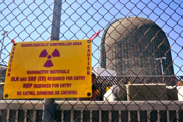 <p>A sign warning of radioactive materials att a nuclear reactor containment building, a few days before it stopped generating electricity at Indian Point Energy Center in Buchanan, NY in 2021</p>