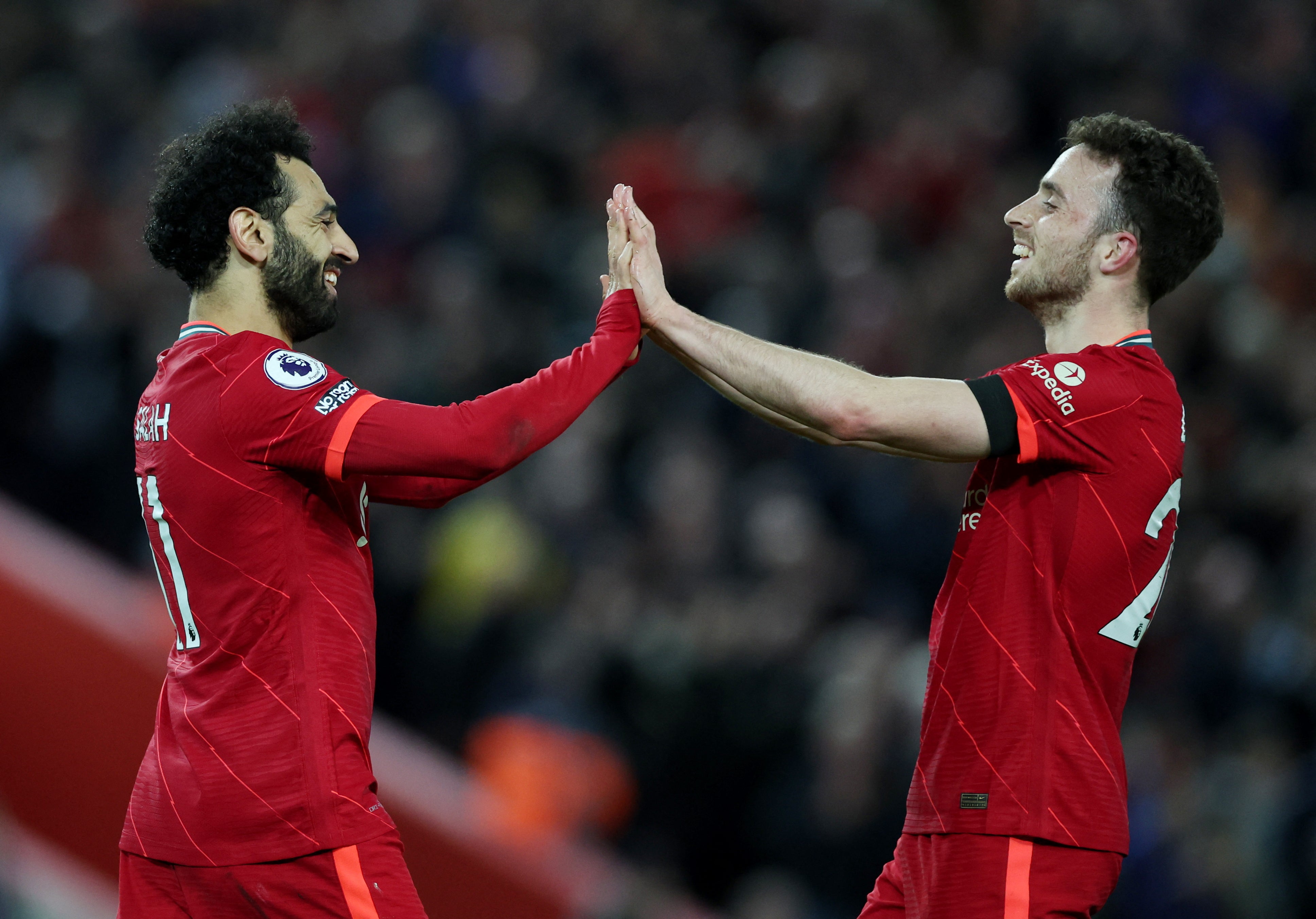 Mo Salah scored twice as Liverpool impressively beat their old rival to move back to the top of the Premier League