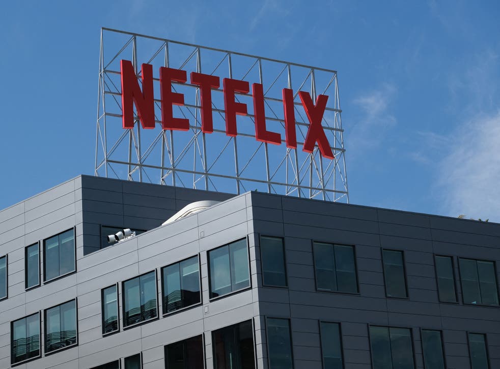 <p>The Netflix logo is seen on top of their office building in Hollywood, California, 2 March 2022</p>