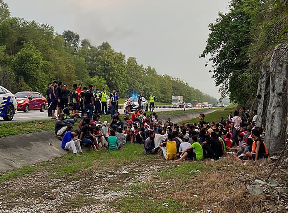 <p>Rohingya refugees who had escaped from Malaysian Immigration’s temporary Sungai Bakap depot detained on the side of a road in Penang on on 20 April </p>